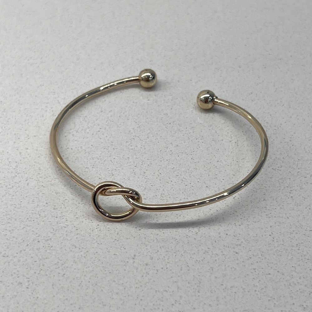Gold knot cuff bracelet